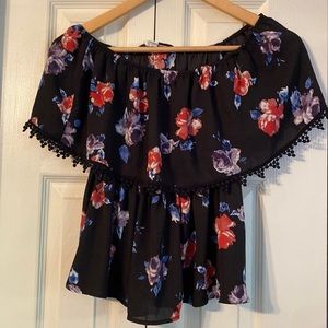 Off the shoulder blouse style shirt. Red and purple flower pattern.